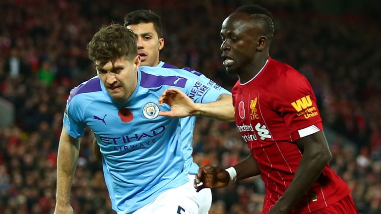 John Stones and Sadio Mane battle for possession at Anfield