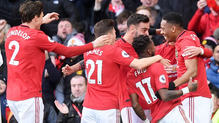 Man Utd players celebrate after Martial volleyed the hosts into the lead