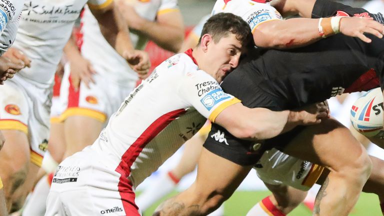 Picture by Laurent Selles/Catalan Dragons/via SWpix.com - 07/03/2020 - Rugby League - Super League - Catalans Dragons v Salford Red Devils - Stade Gilbert Brutus, Perpignan - France - Salford's Ken SIo is tackled by Catalans' Matt Whitley & Josh Drinkwater.