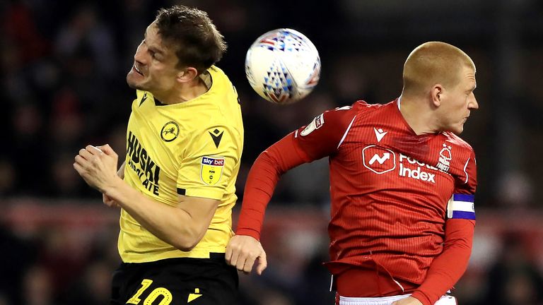 Millwall's Matt Smith (left) and Nottingham Forest's Ben Watson battle for the ball