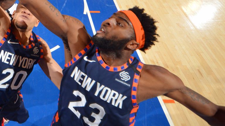 Mitchell Robinson leaps for a rebound against Detroit