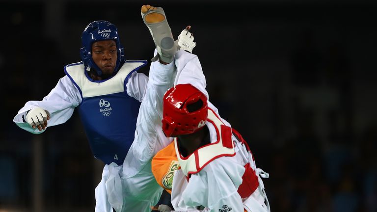 Lutalo Muhammad (L) of Great Britain competes against Cheick Sallah Cisse of Cote d'Ivoire in the Men's Taekwondo -80kg Gold Medal Contest on Day 14 of the Rio 2016 Olympic Games at Carioca Arena 3 on August 19, 2016 in Rio de Janeiro, Brazil. (Photo by Dean Mouhtaropoulos/Getty Images)