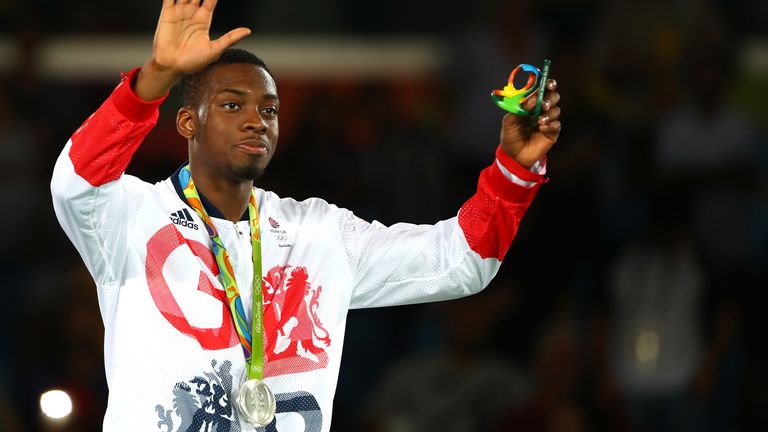 RIO DE JANEIRO, BRAZIL - AUGUST 19: Silver medalist Lutalo Muhammad of Great Britain poses on the podium during the medal ceremony for the Men's Taekwondo -80kg Contest on Day 14 of the Rio 2016 Olympic Games at Carioca Arena 3 on August 19, 2016 in Rio de Janeiro, Brazil. (Photo by Dean Mouhtaropoulos/Getty Images)