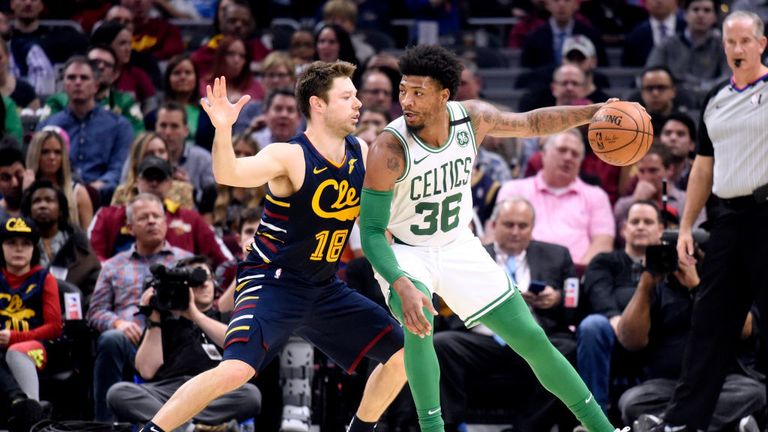 Marcus Smart #36 of the Boston Celtics posts up against Matthew Dellavedova #18 of the Cleveland Cavaliers during the first half at Rocket Mortgage Fieldhouse on March 04, 2020 in Cleveland, Ohio
