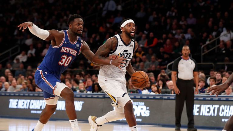 Royce O&#39;Neale #23 of the Utah Jazz drives to the basket against Julius Randle #30 of the New York Knicks during the second half at Madison Square Garden on March 04, 2020 in New York City. 