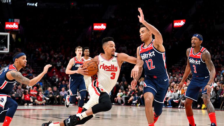 CJ McCollum #3 of the Portland Trail Blazers drives to the basket against Jerome Robinson #12 of the Washington Wizards during the first half of the game at the Moda Center on March 04, 2020 in Portland, Oregon. 