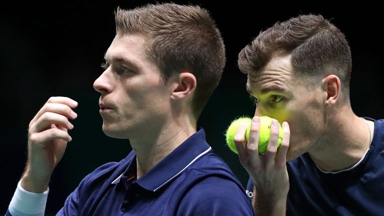 Jamie Murray of Great Britain speaks to his playing partner Neal Skupski before serving during their Davis Cup Group Stage match against Wesley Koolhof and Jean-Julien Rojer of the Netherlands during Day Three of the 2019 Davis Cup at La Caja Magica on November 20, 2019 in Madrid, Spain.