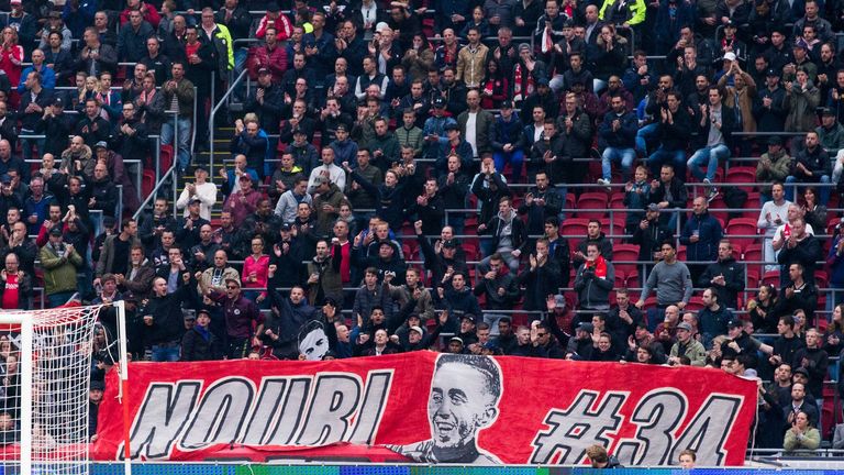 Ajax fans hold a banner up in support of Nouri