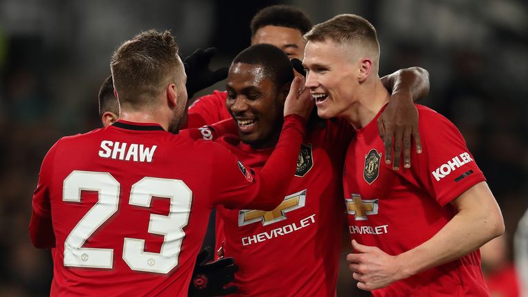 Odion Ighalo celebrates with Manchester United team-mates after scoring against Derby