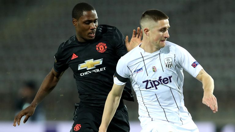 Reinhold Ranftl and Odion Ighalo battle for possession during LASK vs Manchester United