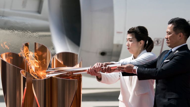 The Olympic flame arrived in Japan from Greece in a scaled down ceremony amid growing doubts the Games will go ahead because of the coronavirus pandemic.