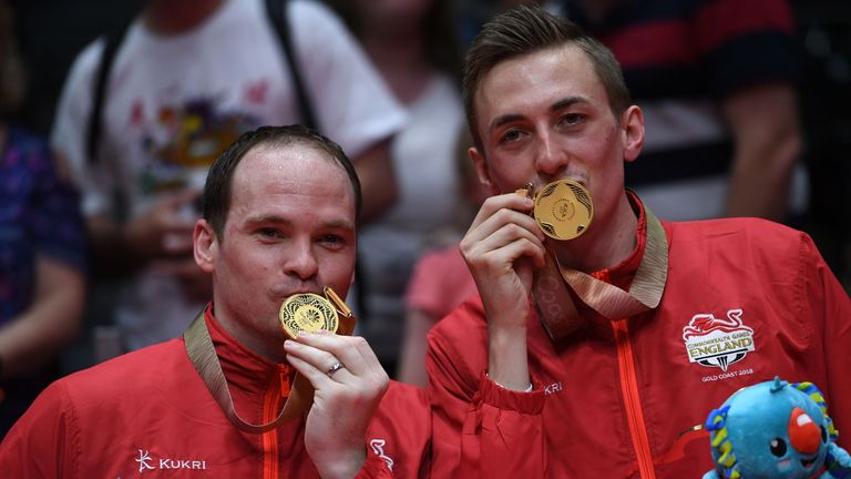 Pitchford kissing his Commonwealth Games gold medal with doubles partner Paul Drinkhall