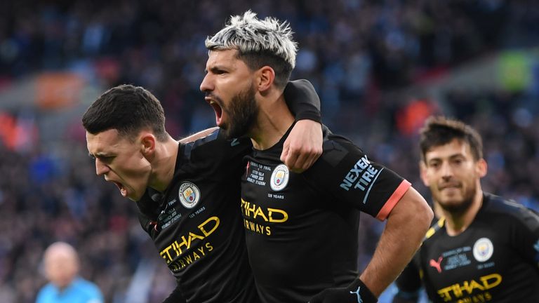 Sergio Aguero celebrates with Phil Foden after opening the scoring for Manchester City against Aston Villa in the Carabao Cup final