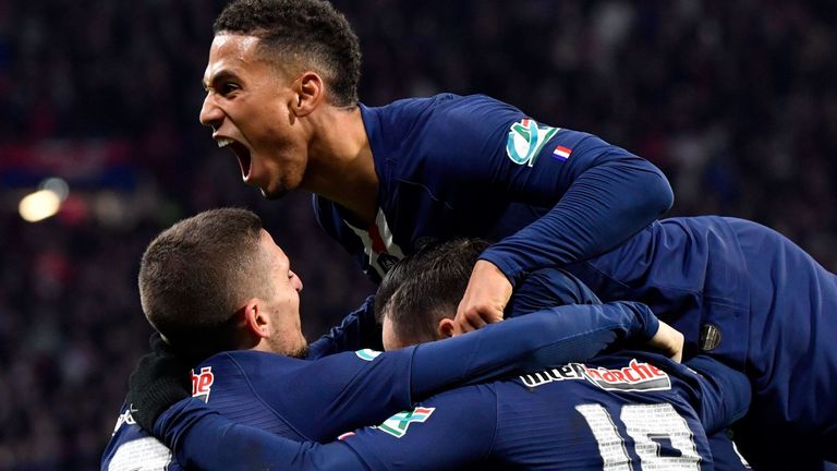 Pablo Sarabia's PSG team-mates celebrate with him after scoring a goal against Lyon