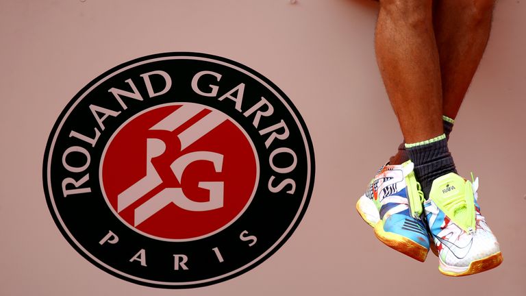 A detailed view of the shoes of Rafael Nadal of Spain as he celebrates victory on the podium following the mens singles final against Dominic Thiem of Austria during Day fifteen of the 2019 French Open at Roland Garros on June 09, 2019 in Paris, France. 