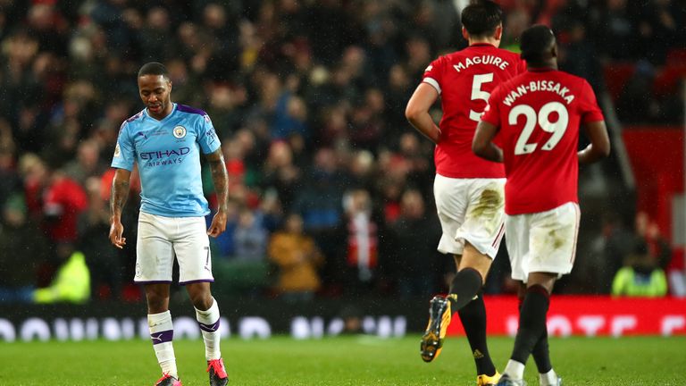 Manchester City's Raheem Sterling looks dejected as Manchester United celebrate during the derby at Old Trafford