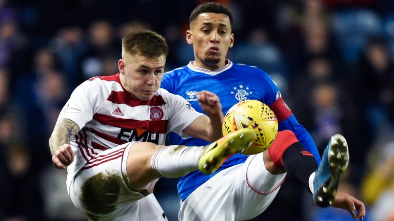 Hamilton&#39;s Scott Martin (L) is pictured in action with Rangers&#39; James Tavernier