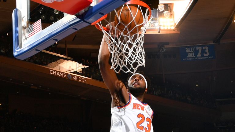 Mitchell Robinson of the New York Knicks dunks the ball against the Oklahoma City Thunder