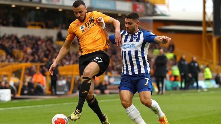 Romain Saiss and Neal Maupay vie for the ball during Wolves and Brighton's Premier League game at Molineux