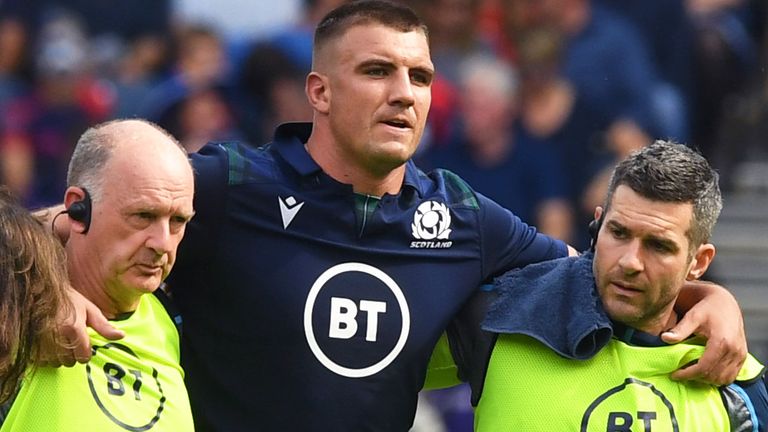 Sam Skinner is helped off injured during Scotland's World Cup warm-up win over France in August 2019