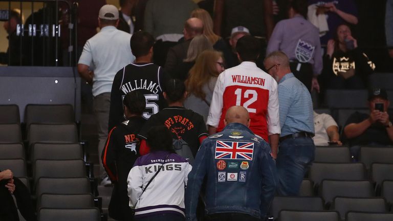 Fans in Sacramento leave the arena following the cancellation of the Pelicans @ Kings games on Thursday night