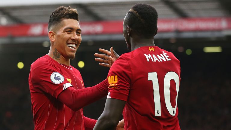 Sadio Mane celebrates scoring against Bournemouth with Roberto Firmino