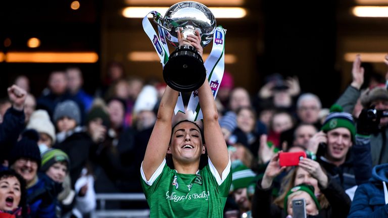 Niamh McGrath of Sarsfields lifts the cup