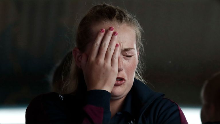 England spinner Sophie Ecclestone can't hide her anguish as rain falls heavily at the Sydney Cricket Ground