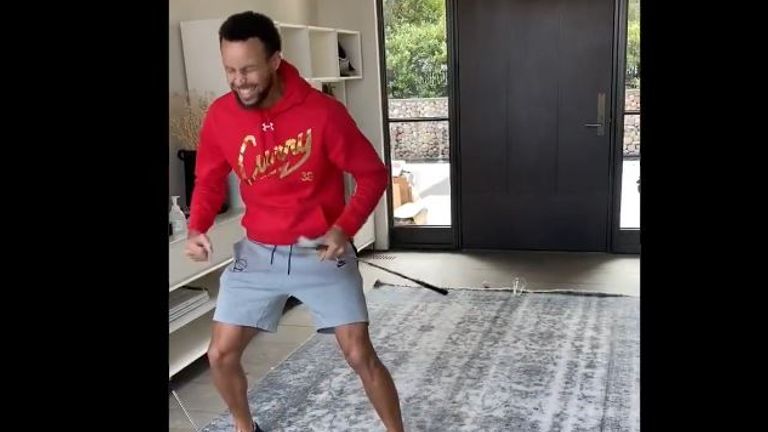 Stephen Curry celebrates after making a golf trick shot in his house