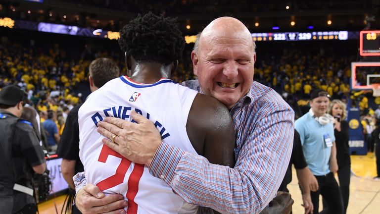 LA Clipper owner Steve Ballmer hugs Patrick Beverley