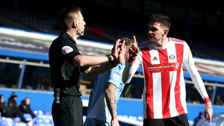 Kyle Lafferty argues with the referee after Luke O'Nien's goal was ruled out for offside