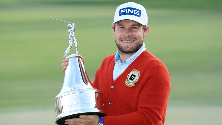 Tyrrell Hatton with the trophy after winning the Arnold Palmer Invitational