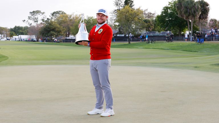 Tyrrell Hatton with the trophy after winning the Arnold Palmer Invitational
