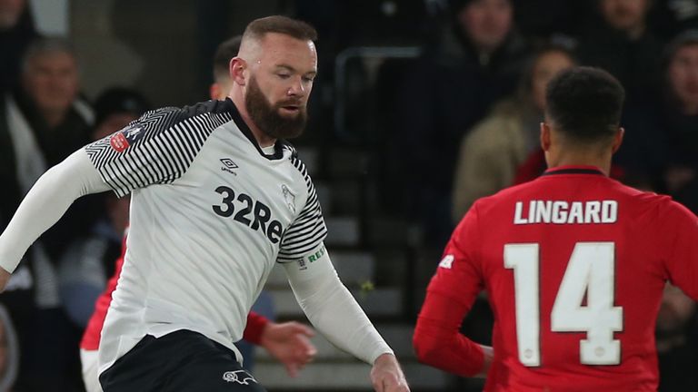 Derby&#39;s Wayne Rooney in action against Manchester United&#39;s Jesse Lingard