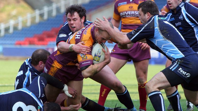 PICTURE BY WILL JOHNSTON/SWpix.com - .Rugby League - Carnegie Challenge Cup - Huddersfield Giants v York City Knights - The Galpharm Stadium, Huddersfield, England - 01/04/07..Copyright - Simon Wilkinson - 07811267706..Huddersfield's Andy Raleigh tries to get through York's Tabua Cakacaka, Lee Lingard and George Raynor