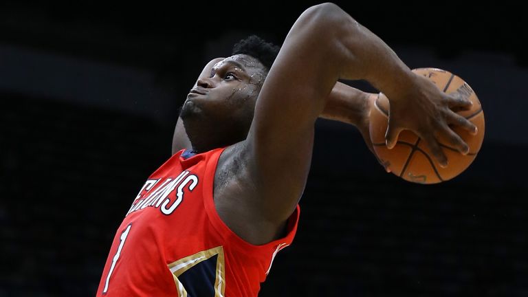 Zion Williamson rises to the rim for a two-handed dunk