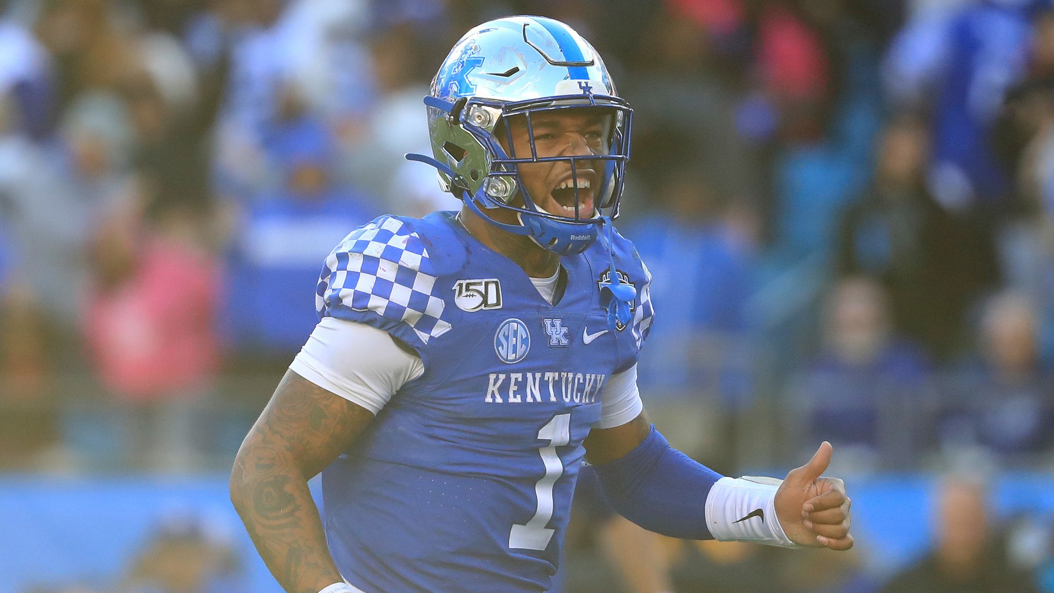 Kentucky's Lynn Bowden Jr. stands on the field after leading his