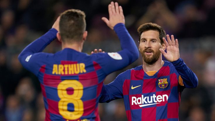 Arthur Melo celebrates with Barcelona team-mate Lionel Messi