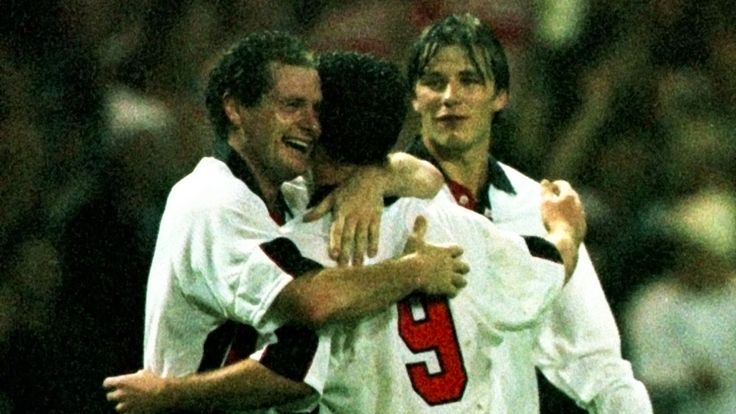 England's Paul Gascoigne and David Beckham celebrate team mate Robbie Fowler's goal,  the second of two goals against Cameroon at Wembley during their friendly international match in November 1997