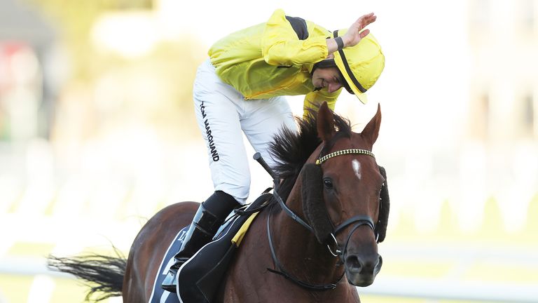 Tom Marquand riding Addeybb celebrates winning the Longines Queen Elizabeth Stakes