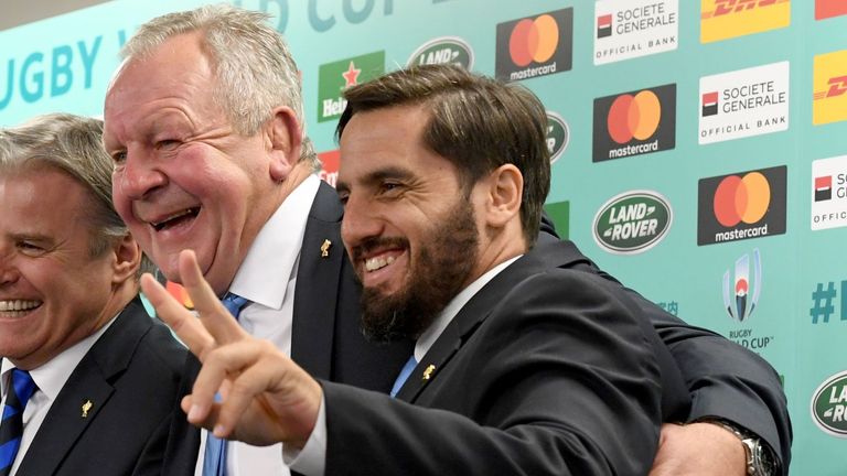 World Rugby chairman Bill Beaumont (2nd R) and deputy chairman Agustin Pichot (R) pose with World Rugby Chief Executive Brett Gosper (2nd L) 