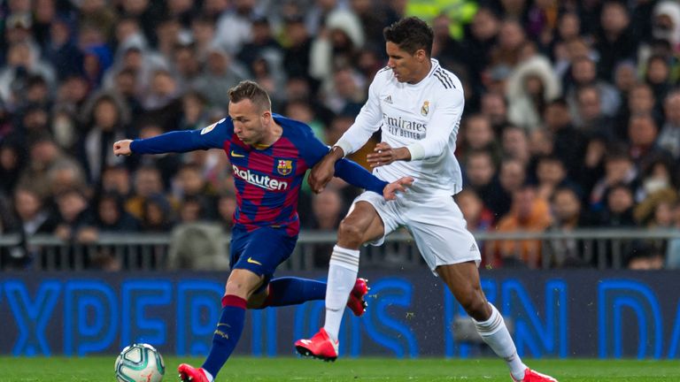 Arthur shields the ball for Barcelona during El Clasico against Real Madrid