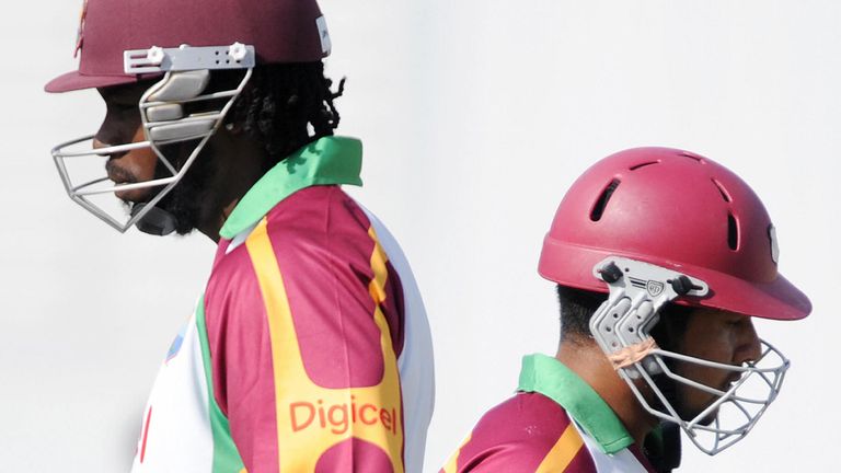 Chris Gayle (L) and batsman Ramnaresh Sarwan exchange nets during a practice session ahead of their second Test match against England in St John's on February 10, 2009