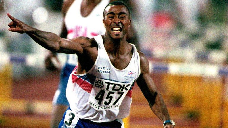 STUTTGART, GERMANY: Britain's Colin Jackson celebrates while crossing the finish line to win the 110m hurdles and set a new world record of 12.91 sec at the World Athletics Championships on 20 August 1993. (Photo credit should read GEORGES GOBET/AFP via Getty Images)