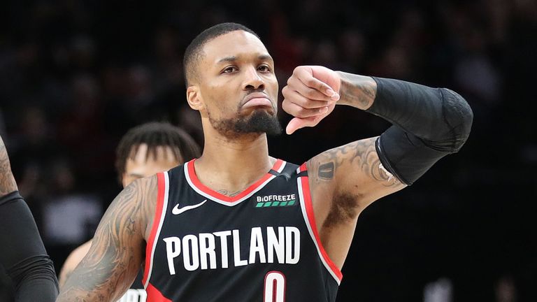 Damian Lillard gestures that its &#39;Dame Time&#39; after draining a clutch three-pointer aginst the Golden State Warriors