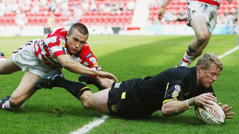 WIGAN - APRIL 18: Darren Albert of Saint Helens beats Jon Whittle of Wigan to score during the Tetley's Super League game between Wigan Warriors and St Helens on April 18, 2003 at The JJB Stadium, Wigan, England. (Photo by Laurence Griffiths/Getty Images)