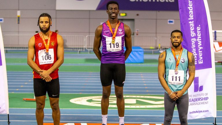 Ethan Akanni on the podium after receiving his BUCS Gold medal for 60m Hurdles at the BUCS Championships (credit - Jonty Mitchell - @photographybyjonty)