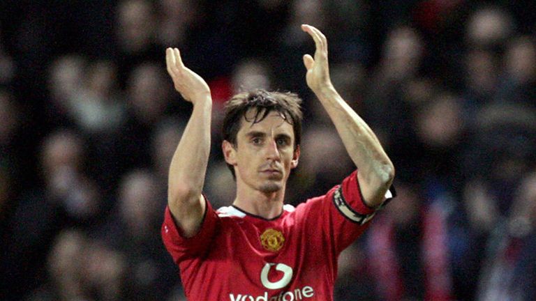 Manchester United captain Gary Neville applauds the crowd after defeating Blackburn Rovers in their English League Cup match at Old Trafford in Manchester, 25 January 2006. 