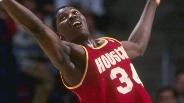 Hakeem Olajuwon corrals a rebound against the Milwaukee Bucks