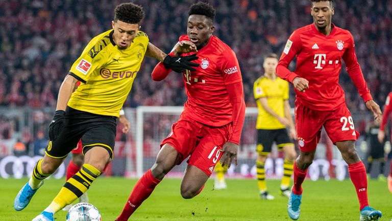 Jadon Sancho takes on Alphonso Davies at the Allianz Arena